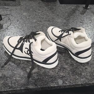 White and Black Athletic Sneakers with Signature Logo